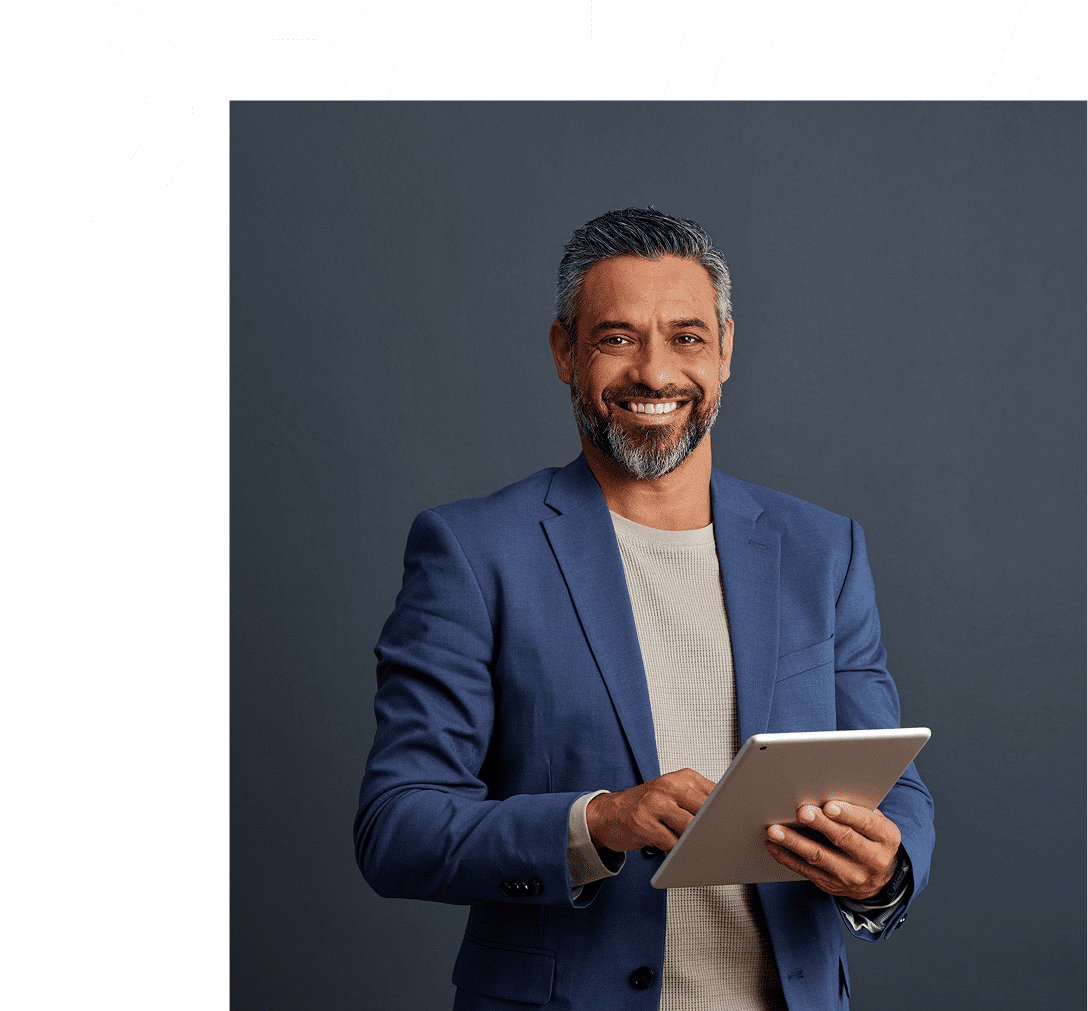 Smiling man in blue suit with tablet.