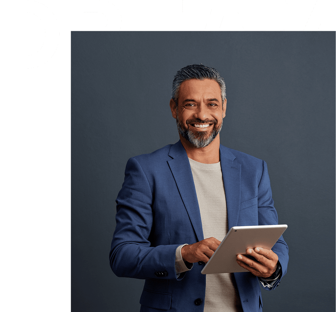 Smiling man in blue suit with tablet.